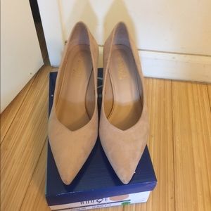 A pair of Pink Suede shoes.